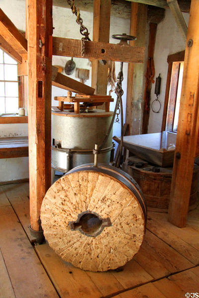 American vertical-wheel watermill (1870s) in Big Mill from Sapelló at Rancho de las Golondrinas. Santa Fe, NM.