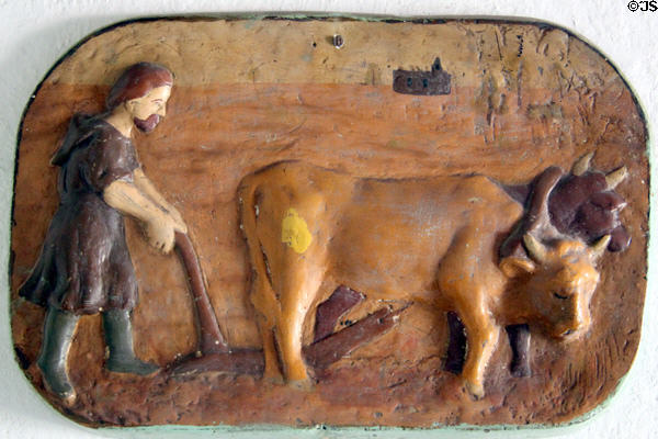 Carved plaque of St. Isidro patron of agriculture in Mora house at Rancho de las Golondrinas. Santa Fe, NM.