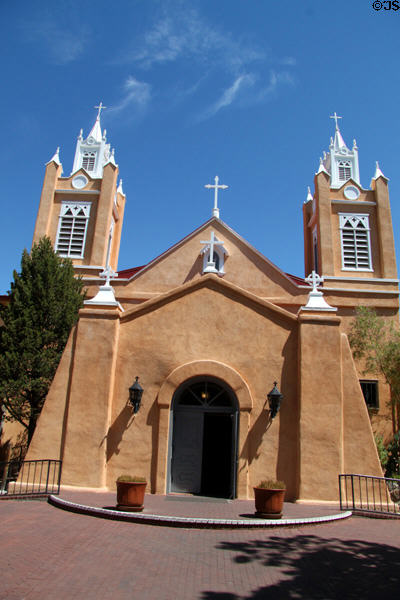 San Felipe de Neri Church (1793) (on Old Town Square) with two towers added 1861. Albuquerque, NM.
