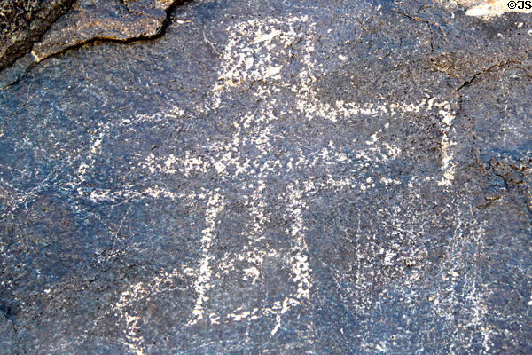 Petroglyph with cross at Petroglyph National Monument. Albuquerque, NM.