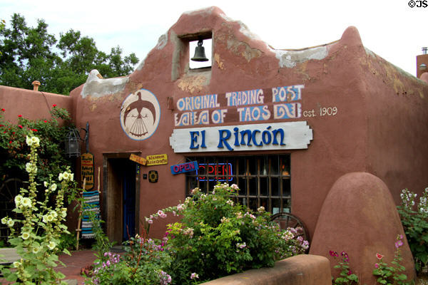 Adobe-style heritage trading post with bell (1909) (114 Kit Carson Road). Taos, NM.