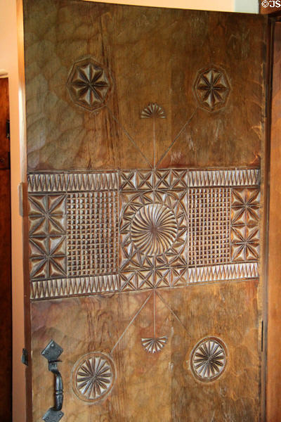 Carved kitchen door by Nicolai Fechin at Taos Art Museum. Taos, NM.