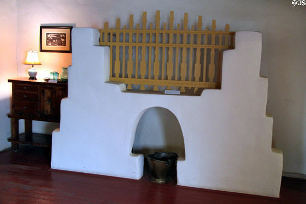 Mock fireplace to hide hot water heater by Mary Greene Blumenschein at Blumenschein Home & Museum. Taos, NM.