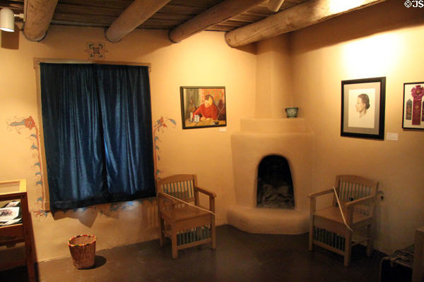 Room with corner fireplace at Blumenschein Home & Museum. Taos, NM.