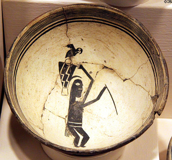 Mimbres bowl showing woman with parrot (c1100) from Mogollon southern New Mexico at Millicent Rogers Museum. Taos, NM.