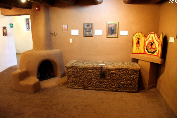 Gallery with fireplace, chest or icons at Millicent Rogers Museum. Taos, NM.