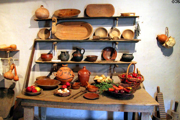 Wooden & pottery vessels in kitchen at Hacienda de los Martinez. Taos, NM.