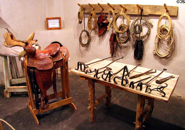 Saddles, tack & branding irons at Hacienda de los Martinez. Taos, NM.