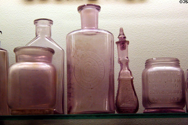 Antique glass bottles turned purple at Nevada State Museum. Carson City, NV.