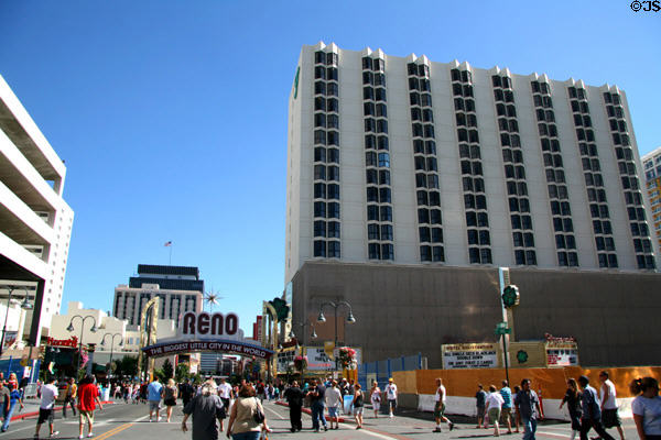 Fitzgeralds Casino (1976) (16 floors) over Reno - The Biggest Little City in the World sign. Reno, NV.