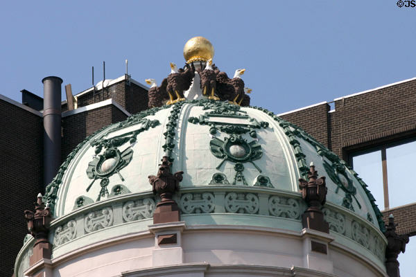 Carved eagles circle dome on 35 State St. Albany, NY.