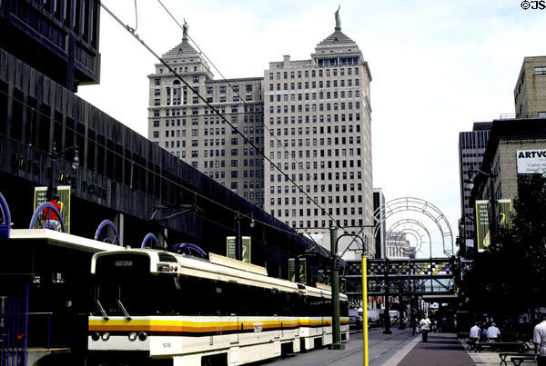 Main Street Transit Mall with streetcar against Liberty Building with twin Statues of Liberty. Buffalo, NY.