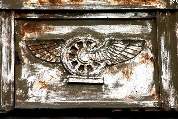 Winged rail wheel symbol rusted on Central Terminal building. Buffalo, NY.