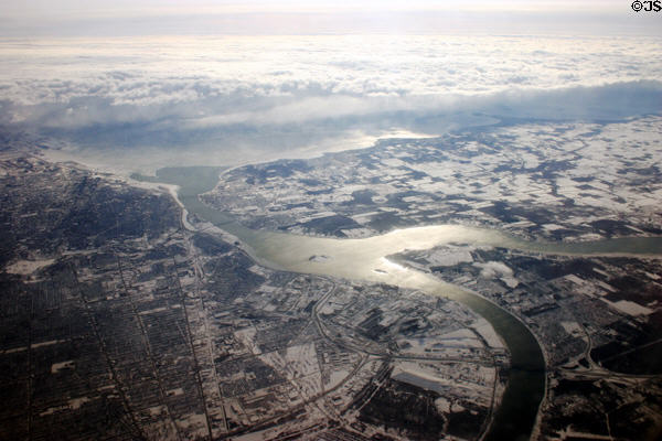 Aerial view looking south to Buffalo (l) & Fort Eire, Canada (r) with Lake Erie under cloud in distance & tip of Grand Island which splits Niagara River in foreground. NY.