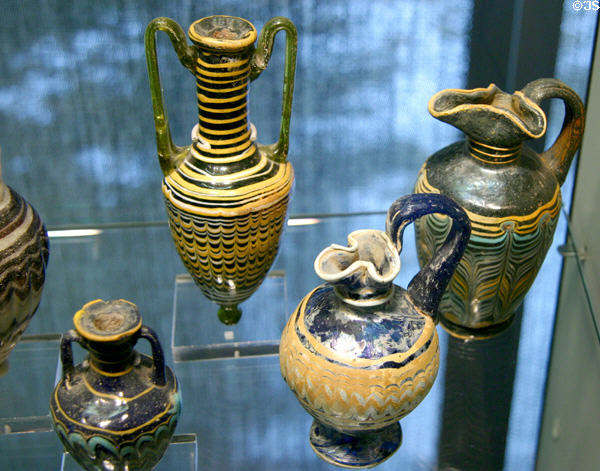 Egyptian glass pitchers & bottles (6th-1stC BCE) at Corning Museum of Glass. Corning, NY.