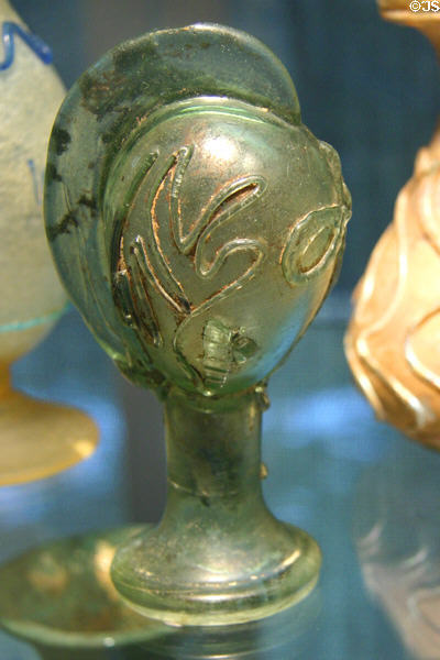 Blown glass Roman flask shaped as helmet (3rd C) at Corning Museum of Glass. Corning, NY.