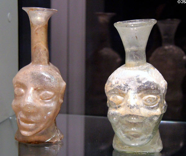 Roman glass grotesque head flasks found in Germany & France (3rd-4thC) at Corning Museum of Glass. Corning, NY.