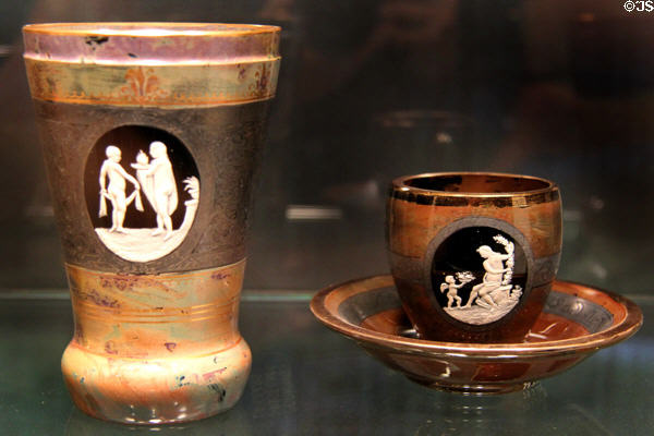 Bohemian Opaque Hyalith glass beaker with love allegories plus cup & saucer (c1835-50) possibly by Anton Ambrosius Egermann of Haida at Corning Museum of Glass. Corning, NY.