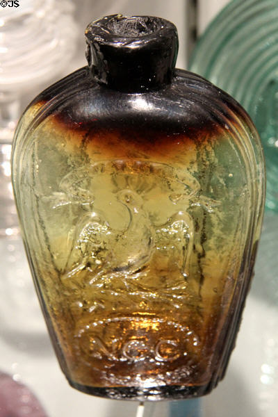American glass liquor flask with Masonic eagle marked "NGC" (1820s) at Corning Museum of Glass. Corning, NY.