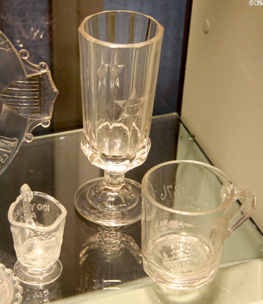 Glass souvenir cups & beer glass (1876) from Philadelphia Centennial Exhibition at Corning Museum of Glass. Corning, NY.