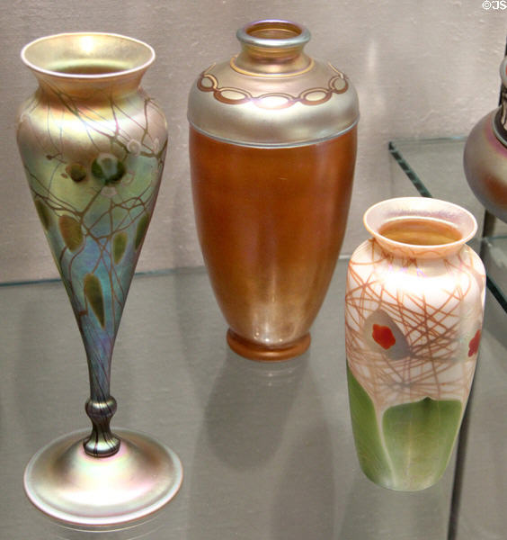 Aurene vase with millefiori glowers (c1905-10); brown Aurene vase (c1910); & Aurene vase (1908-12) by Frederick Carder for Steuben Glass at Corning Museum of Glass. Corning, NY.