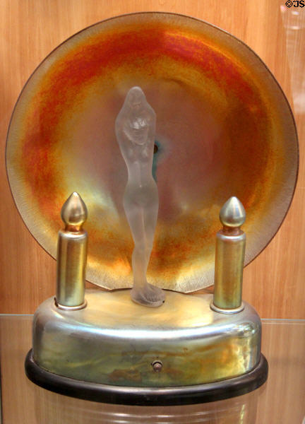 Art Deco Aurene table lamp with large disk behind figure (1920s) by Steuben Glass at Corning Museum of Glass. Corning, NY.