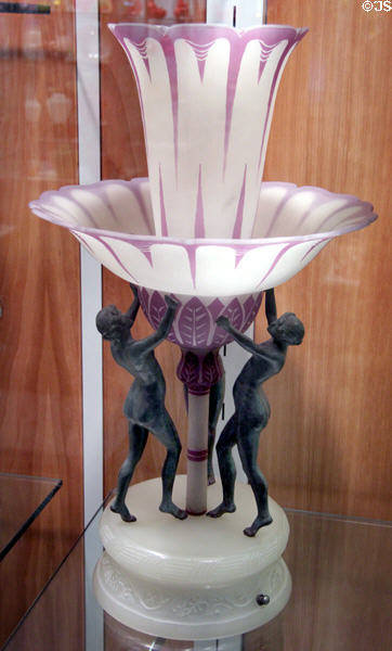 Metal & glass Art Deco table lamp with 3 figures holding vessel (1920s) by Steuben Glass at Corning Museum of Glass. Corning, NY.