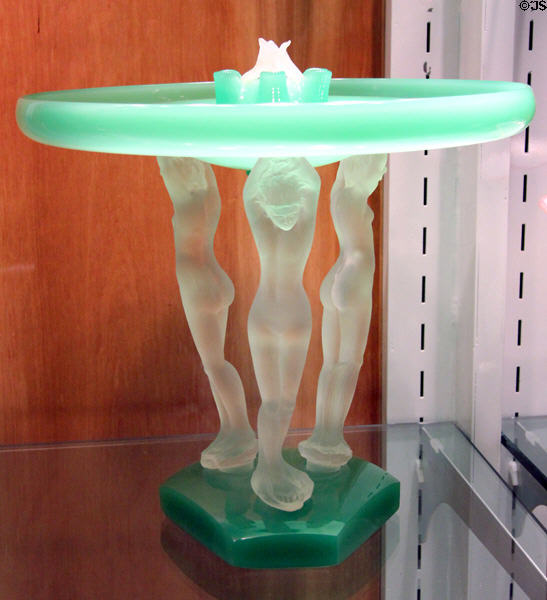 Art Deco table sculpture with 3 figures holding large disk (1920s) by Steuben Glass at Corning Museum of Glass. Corning, NY.