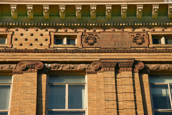 Upper story decoration of First National Bank & Trust building. Corning, NY.