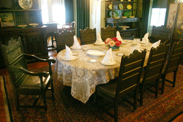 Dining room in Roosevelt home with chair left turned back to allow FDR access from his wheelchair. Hyde Park, NY.