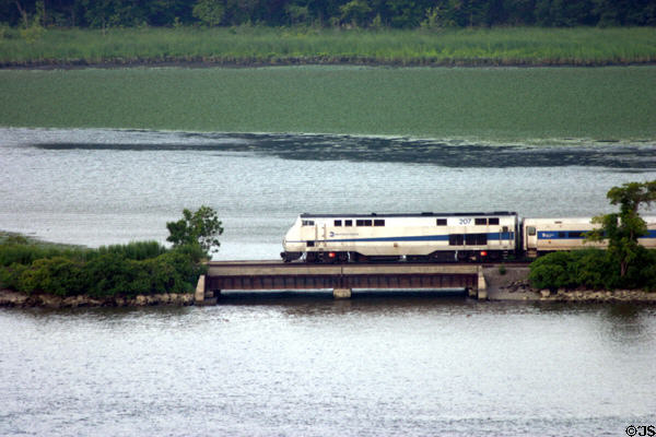Metro North Railroad locomotive along Hudson River opposite West Point. NY.