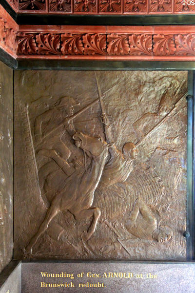 "Wounding of Gen. Arnold in the Brunswick redoubt" bronze relief (1885) by J.C. Markham in Saratoga Monument. Schuylerville, NY.