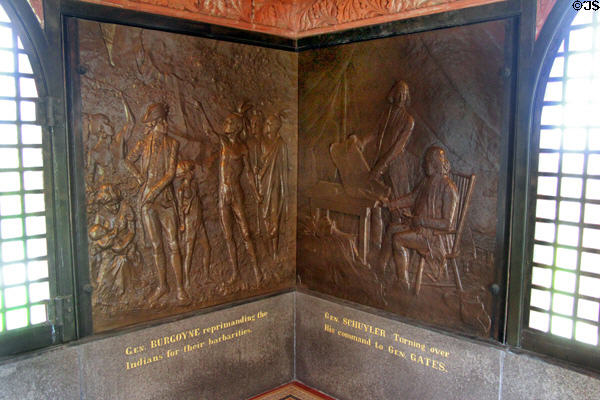 "Gen. Burgoyne reprimanding the Indians for their barbarities" & "General Schuyler turning over his command to Gen. Gates" bronze reliefs (1885) by J.C. Markham in Saratoga Monument. Schuylerville, NY.
