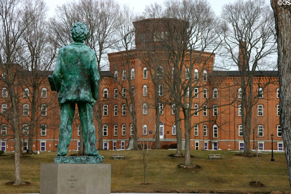 Sculpture of Mark Twain looks over Cowles Hall at Elmira College. Elmira, NY.
