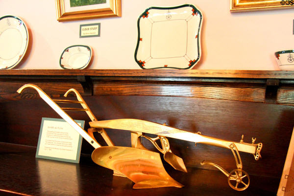Gold plated model of Oliver Chilled Plow presented to Elbert Hubbard when he wrote article (1909) on inventor James Oliver at Elbert Hubbard Roycroft Museum. East Aurora, NY.