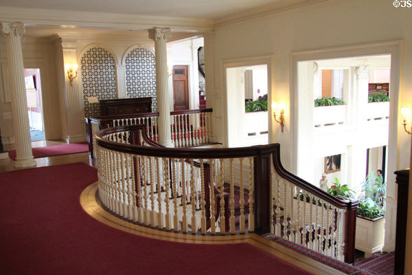 Upstairs hall with curved staircase railing at Eastman House. Rochester, NY.