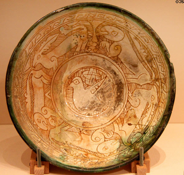 Persian earthenware bowl with bird & creatures (1200-99 CE) at Memorial Art Gallery. Rochester, NY.
