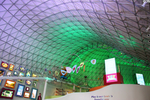 Colorfully lit triodetic space frame Interior at The Strong National Museum of Play. Rochester, NY.