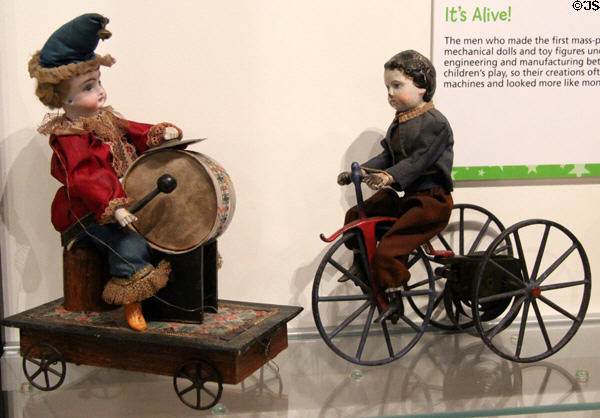 Mechanical toys beating drum & riding tricycle at The Strong National Museum of Play. Rochester, NY.
