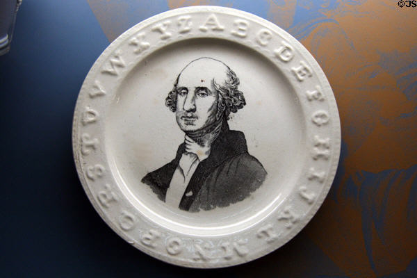 Porcelain plates with Washington's image & alphabet around rim at Federal Hall. New York, NY.