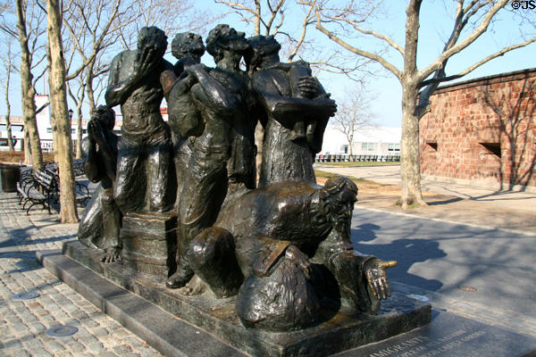 The Immigrants sculpture group (1973) by Luis Sanguino outside Castle Clinton National Monument. New York, NY.