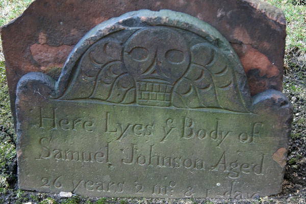 Tombstone (1700s) with skull in Trinity Church. New York, NY.