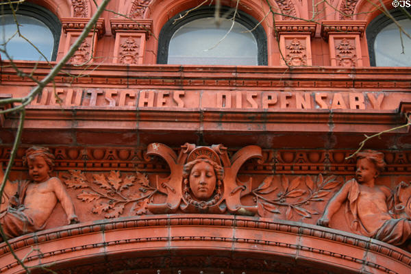 Terra cotta details of Deutsches Dispensary with Caritas. New York, NY.