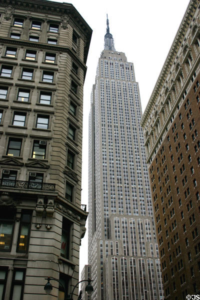 1328 Broadway & Herald Towers Apartments frame Empire State Building. New York, NY.
