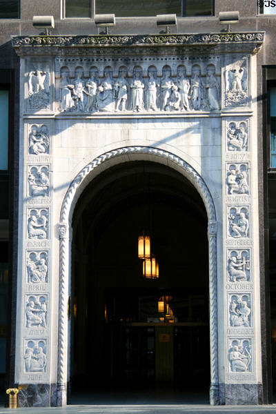 Zodiac signs around entrance of Salmon Tower (now NYU Midtown Center). New York, NY.