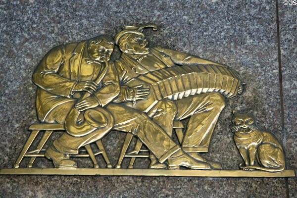 Sax & concertina performers bronze decoration on Radio City Music Hall. New York, NY.