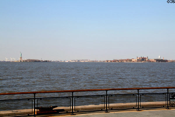 New York harbor view between Statue of Liberty & Ellis Island. New York, NY.