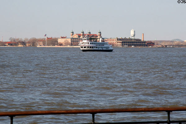 John James Audubon tour boat cruises past Ellis Island. New York, NY.