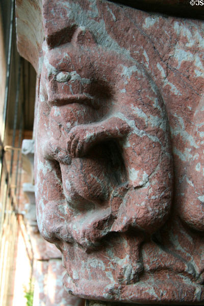Beast devouring a man carved on capital of Cuxa Cloisters at The Cloisters. New York, NY.
