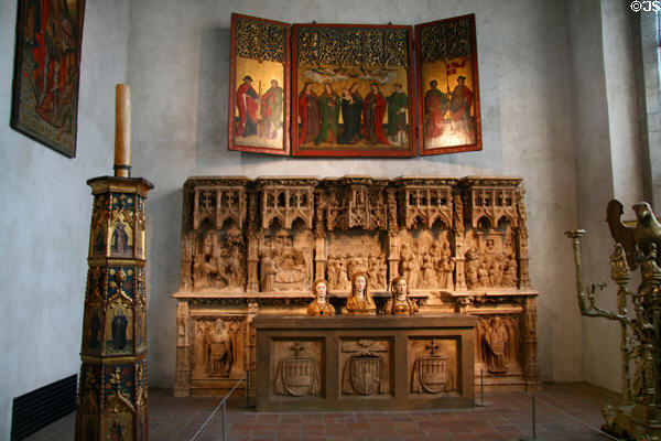 Altarpiece (c1470) from Burg Weiler, Germany plus polychromed Pashal candle holder (1450-1500) from Castilla-León, Spain at The Cloisters. New York, NY.